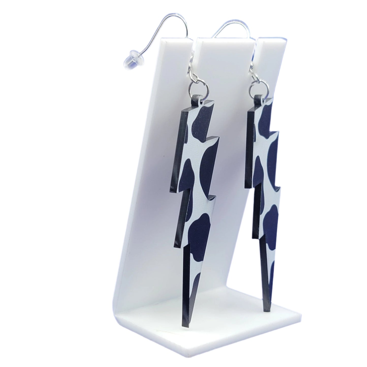 Cow print lightning bolt earrings
