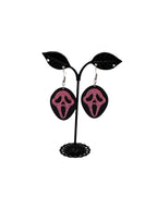 Pink and black scream earrings