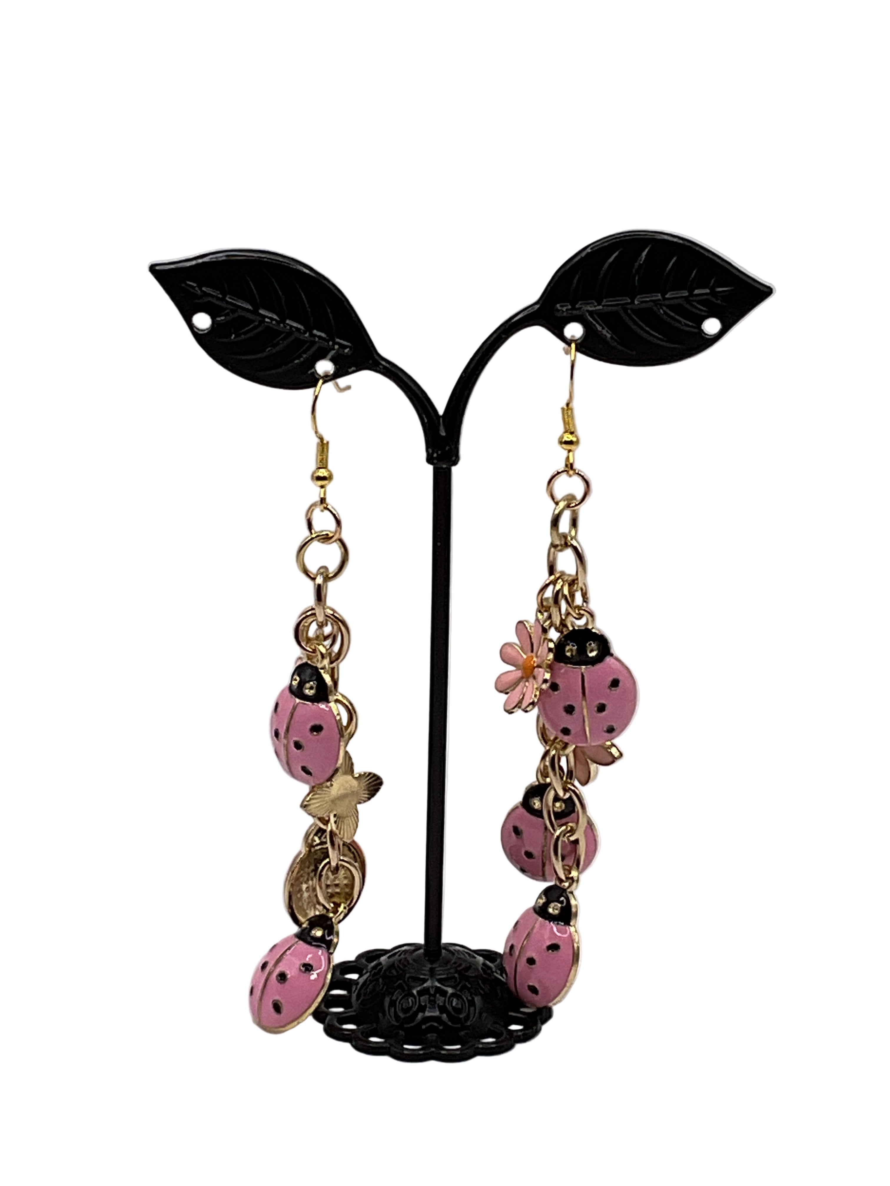 Pink ladybug and flower earrings Main image