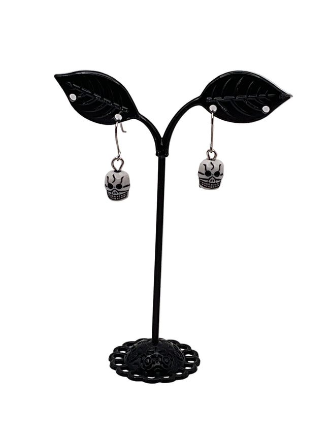 Tiny Skull Earrings Hover Image