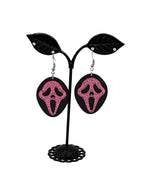Pink and black scream earrings
