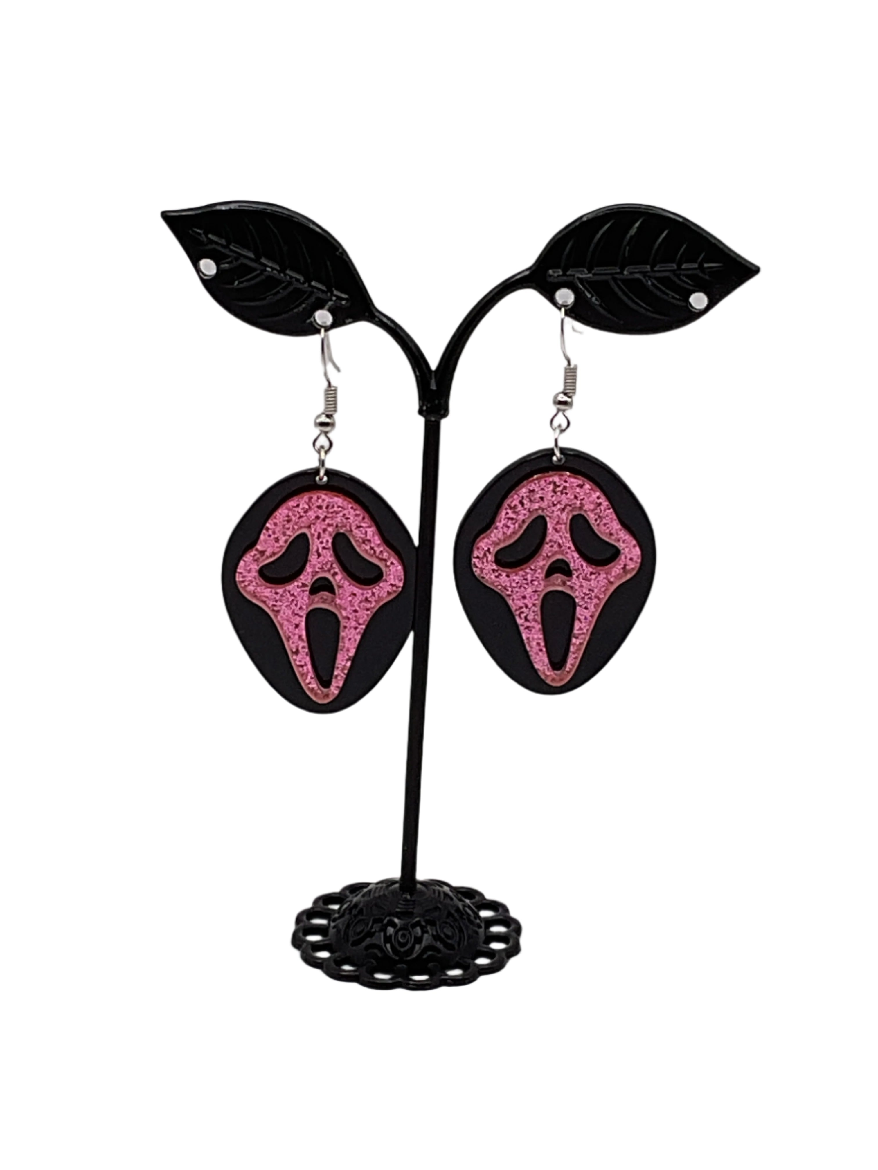 Pink and black scream earrings