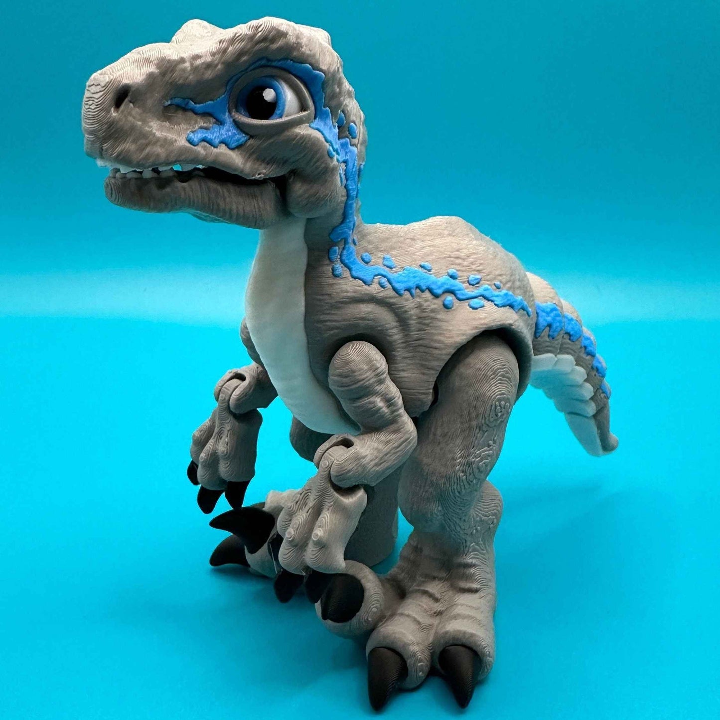 Articulated Velociraptor Dinosaur 3D Printed Toy | Stlflix | Blue | Raptor Gray