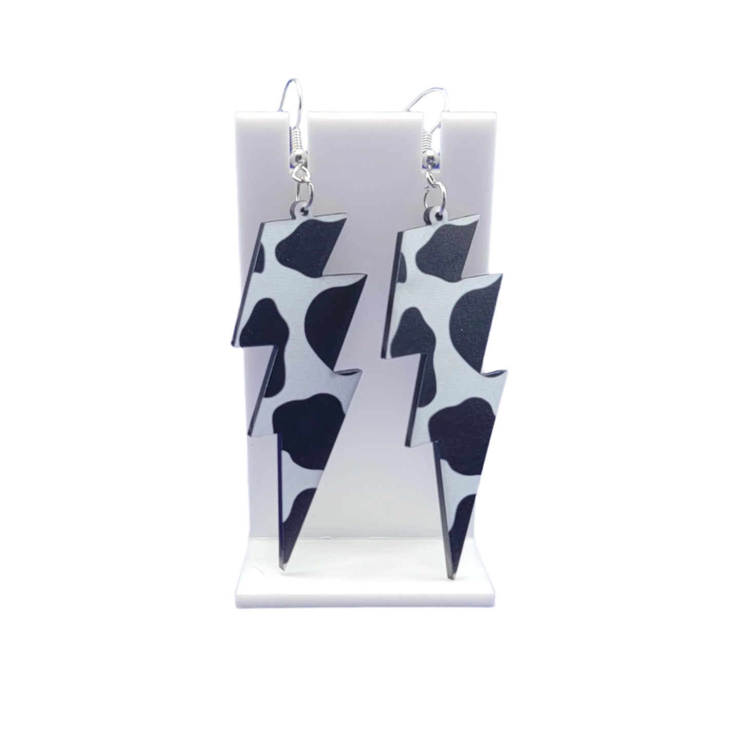 Cow print lightning bolt earrings