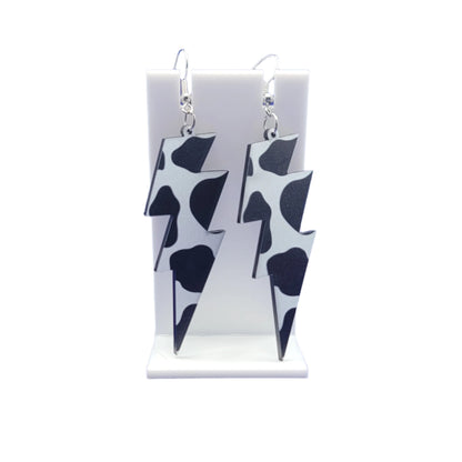 Cow print lightning bolt earrings